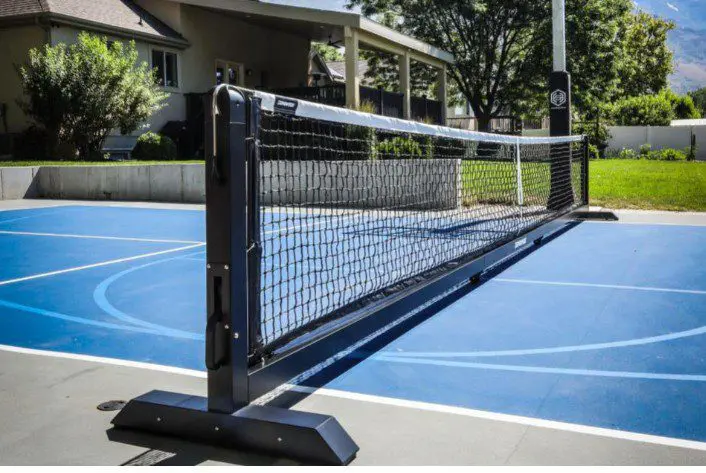 Portable net on blue outdoor court