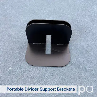 Portable divider support brackets on gray surface