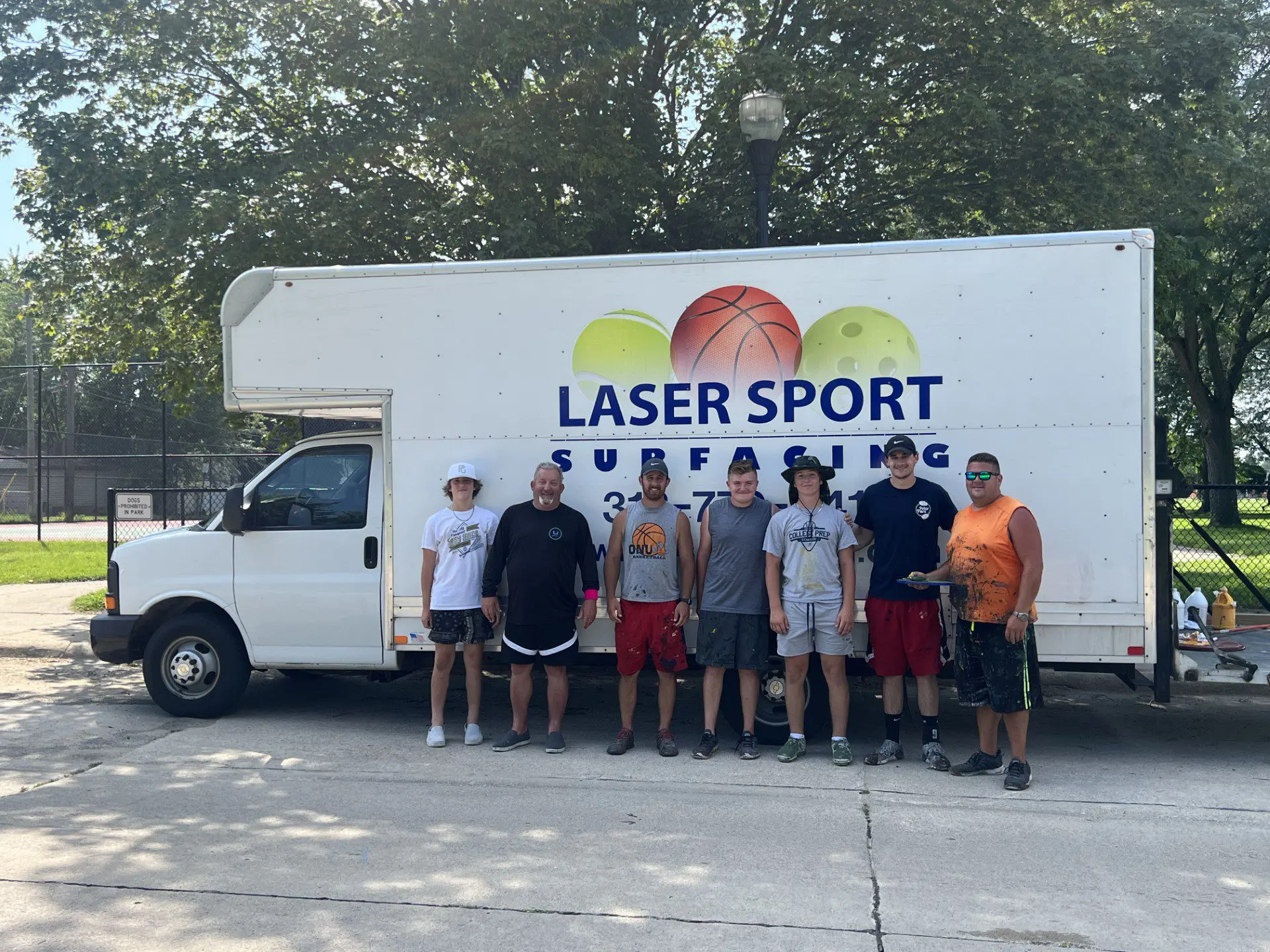 Crew standing in front of Laser Sport truck